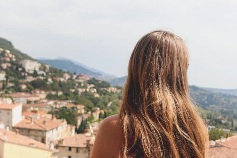 Girl looking out over Grasse view in France